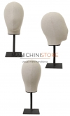 Female display head in linen with black base